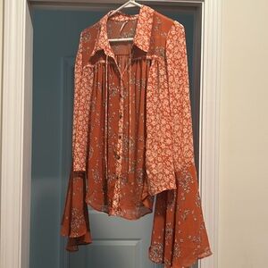 Free people button up top with bell sleeves size L.